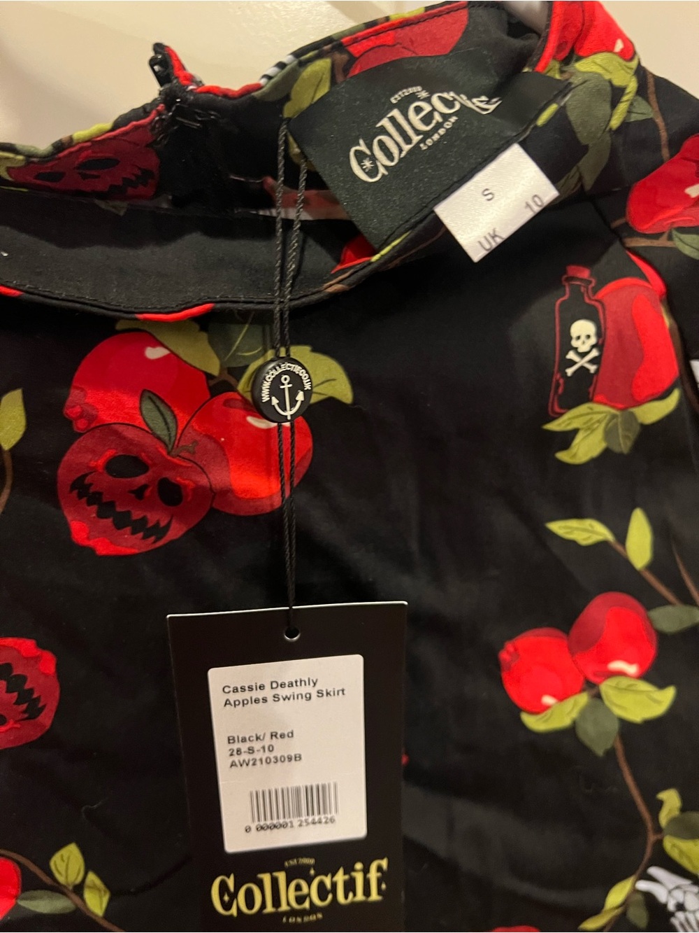 Collectif Cassie Swing Skirt in Black with Red Apple Print